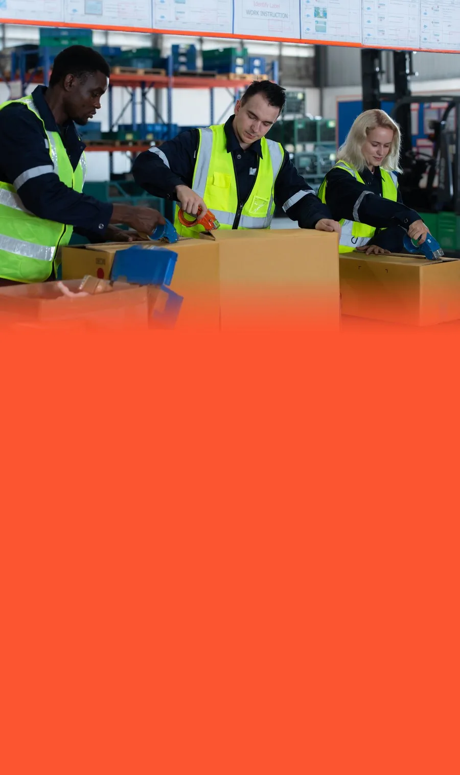 Three workers assembling multi-item kits into cartons