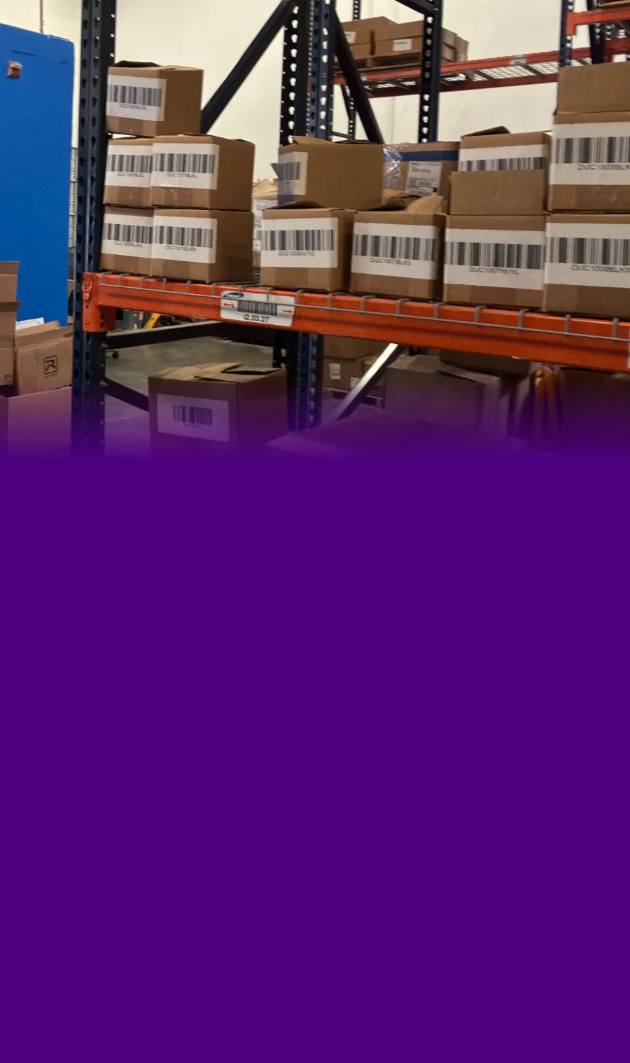 Barcoded client inventory cartons on pallet racking in the Bob Lilly Promotions warehouse in Garland, Texas