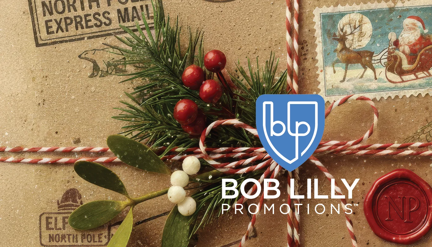 North Pole Express holiday box art designed by Bob Lilly Promotions, kraft paper with holiday postal stamps, twine and greenery